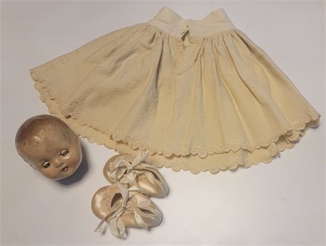 Vintage doll head, doll skirt and pretty vintage lace shoes
