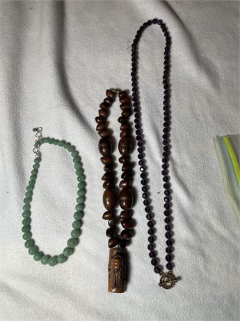 Three Necklaces - Crystal, Carved stn wood, and carved jade