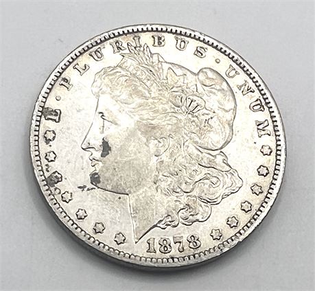 1878 Morgan Dollar with Seven Tail Feathers OVER Eight Tail Feathers.